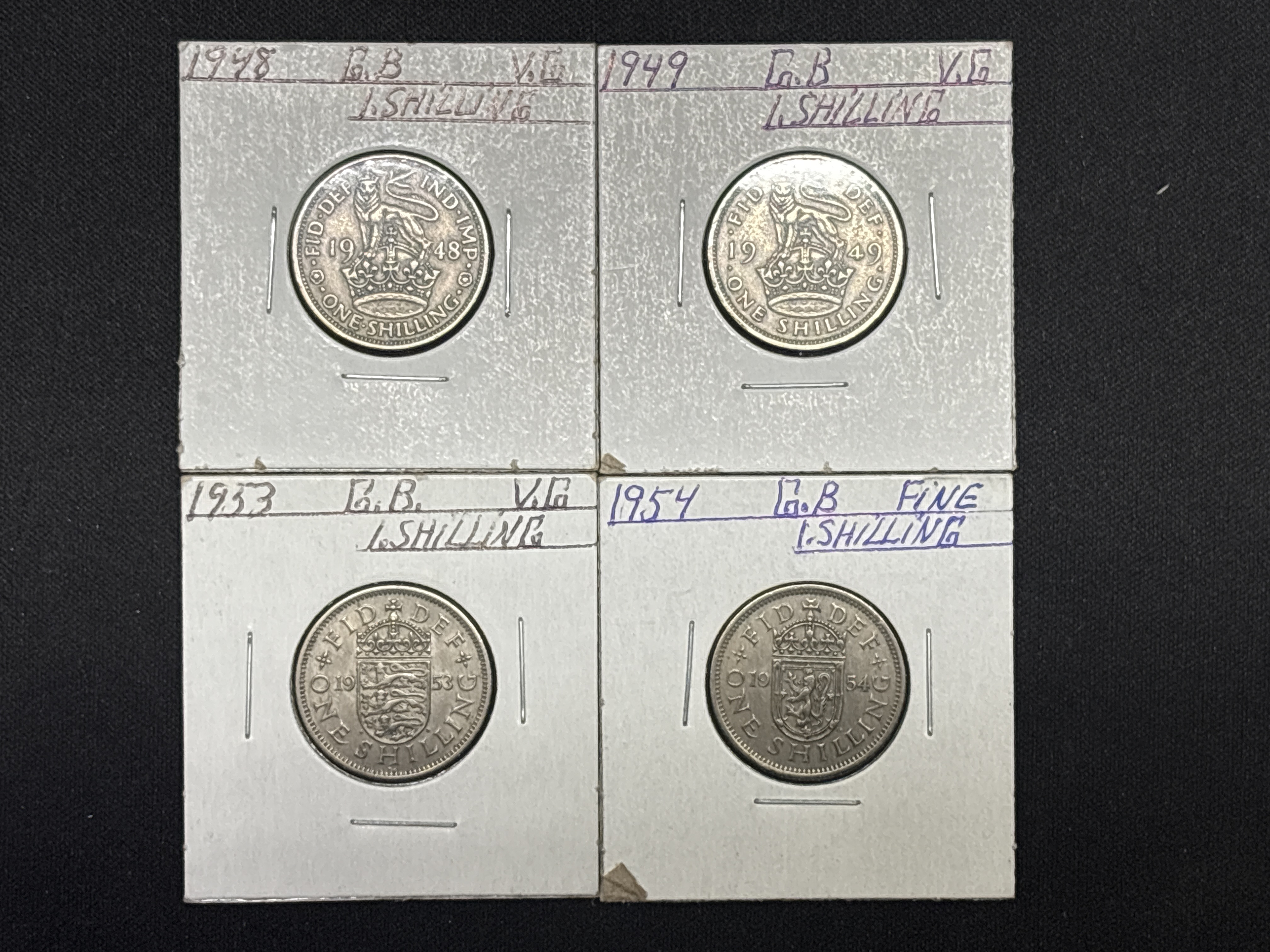 LOT 2026-920 — Ensemble de 4 pièces de monnaie britanniques d’un shilling, présentées… — photo 1